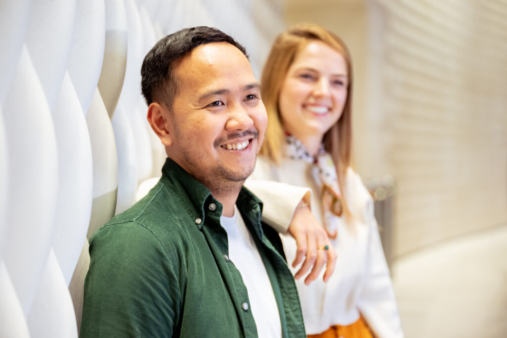 Two people smiling